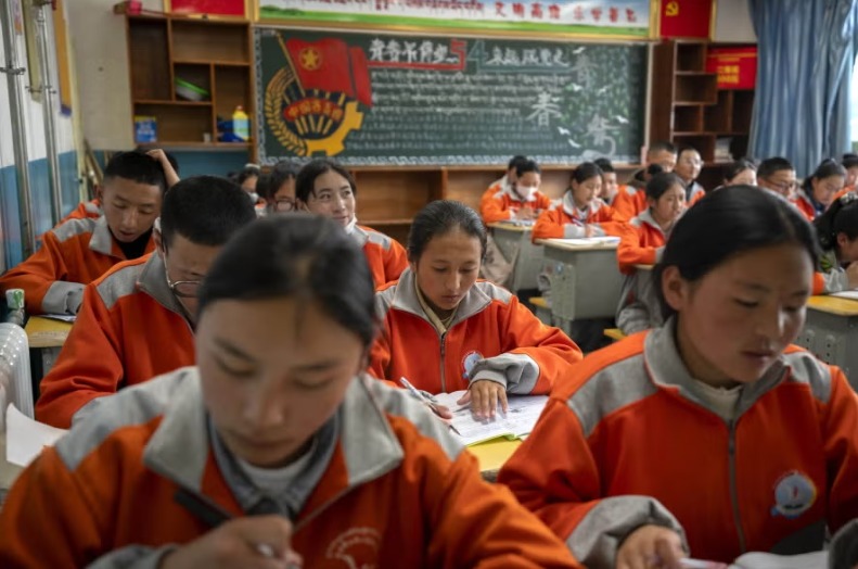 Tibetan preschool children in classroom during Mandarin language instruction